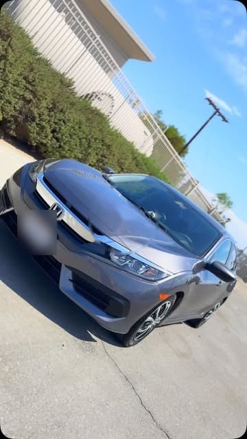 A gray Honda Civic after front-end repair