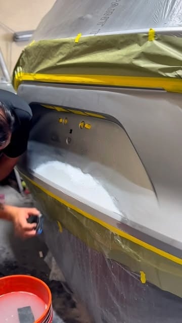 A panel masked off and primed in the paint booth