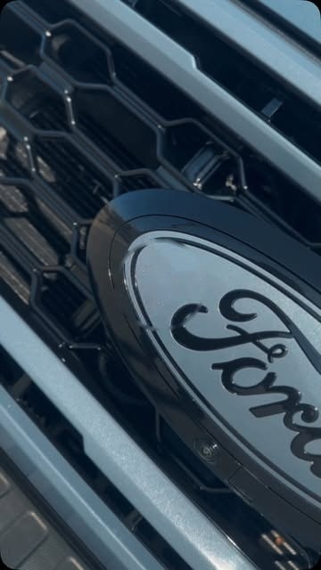 Close-up of a color-matched Ford grill and emblem
