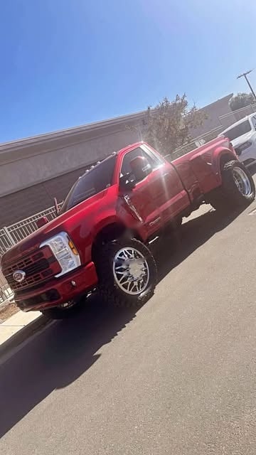 A red Ford F-350 dually after a color-matched paint job