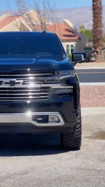 A black Chevrolet Silverado after a blackout